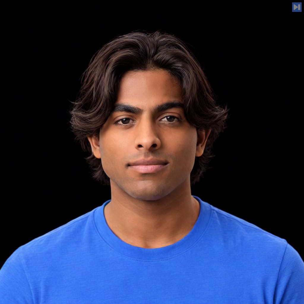 Head-and-shoulders portrait of Adam Majmudar against a black background.