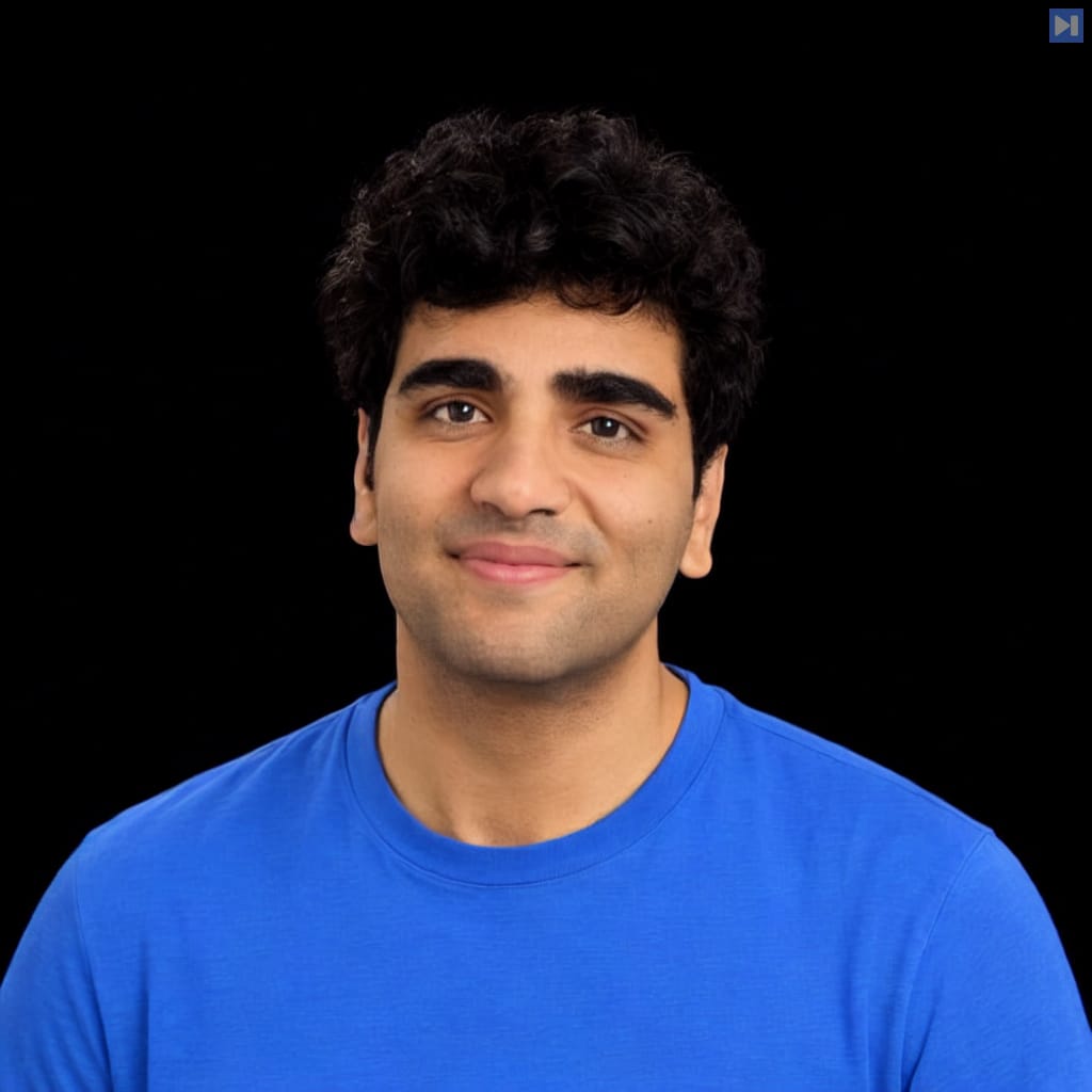 Head-and-shoulders portrait of Adi Singh against a black background.