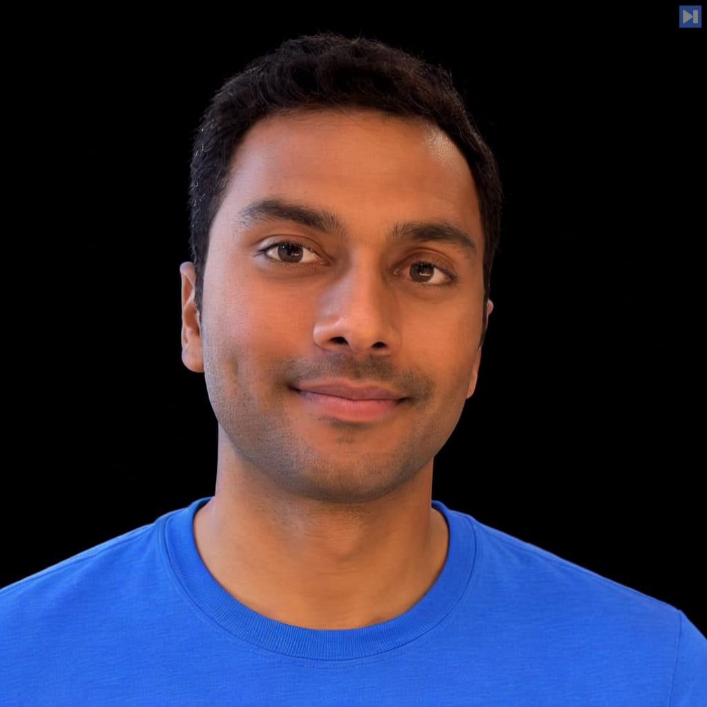 Head-and-shoulders portrait of Akshay Nathan against a black background.