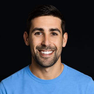 AI-generated portrait of Alex Lieberman wearing an AI Videos-blue top against a black background.