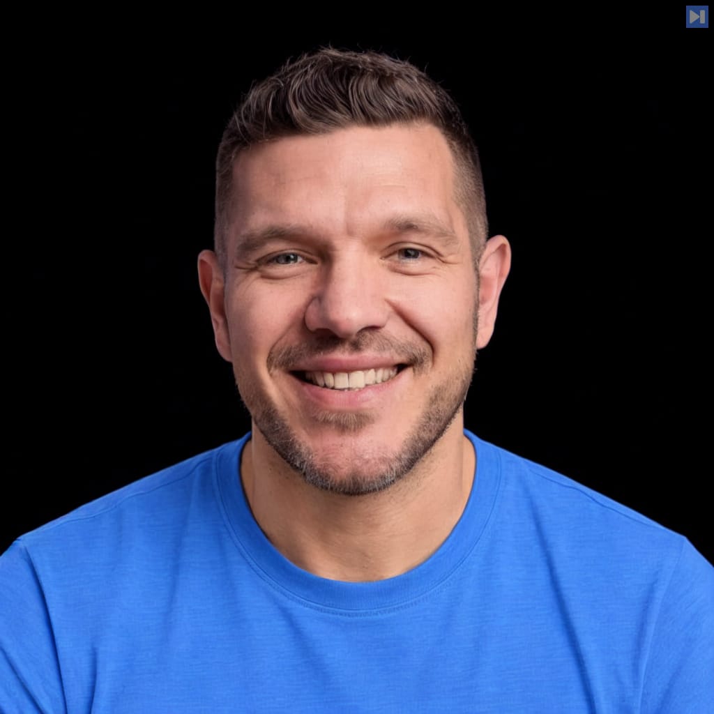 Head-and-shoulders portrait of Alex Volkov against a black background.