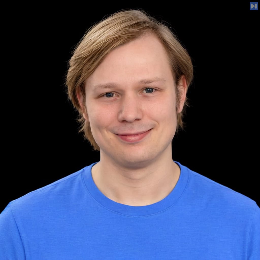 Head-and-shoulders portrait of Alexander Mattick against a black background.