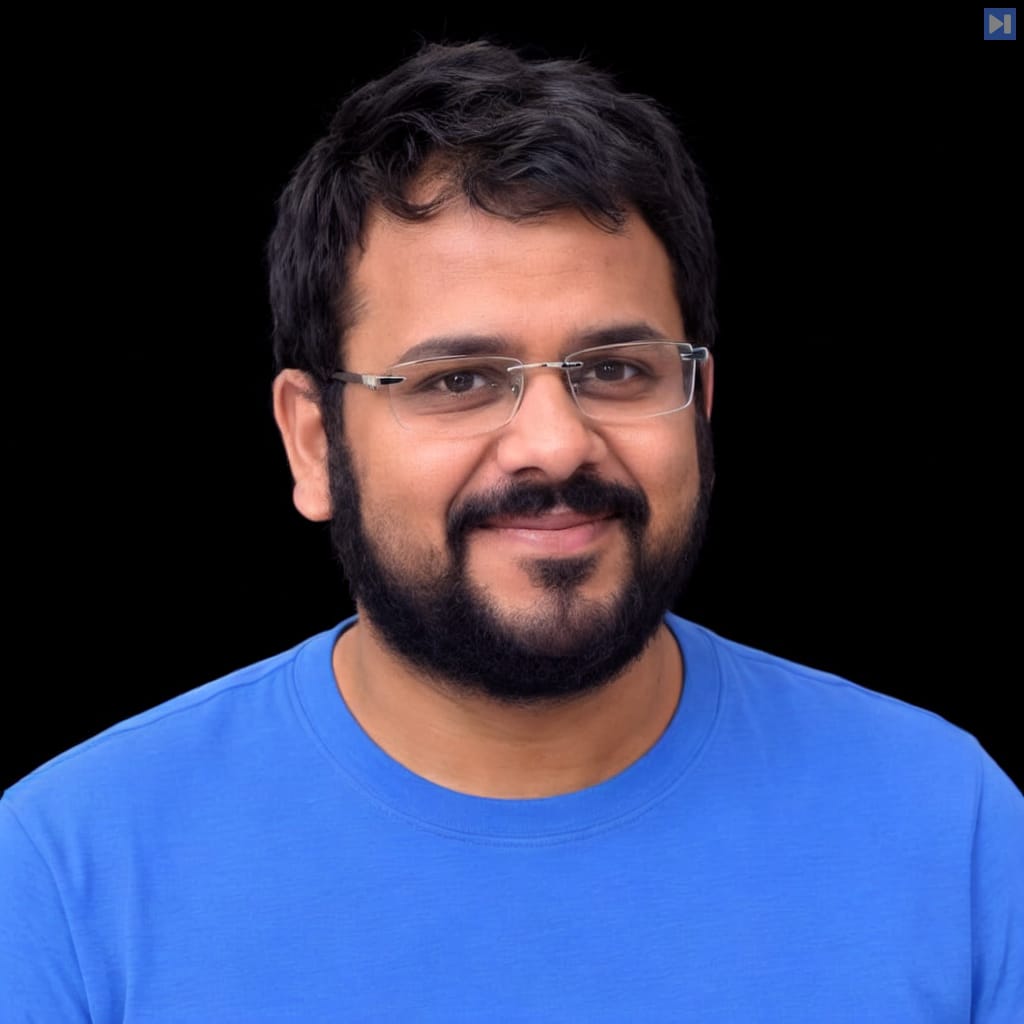 Head-and-shoulders portrait of Aman Gupta against a black background.