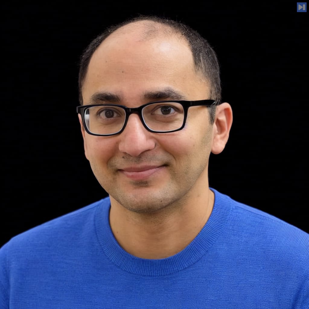 Head-and-shoulders portrait of Amit Desai against a black background.