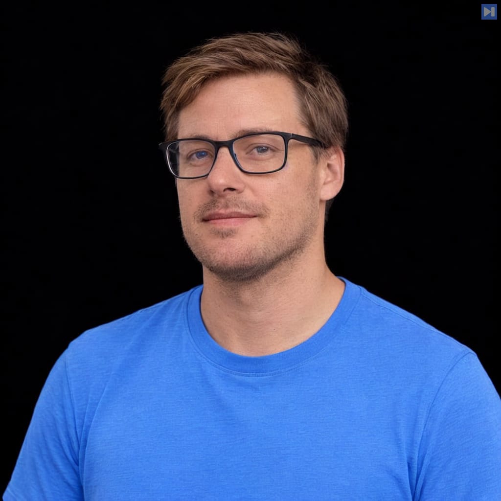 Head-and-shoulders portrait of Anders Swanson against a black background.