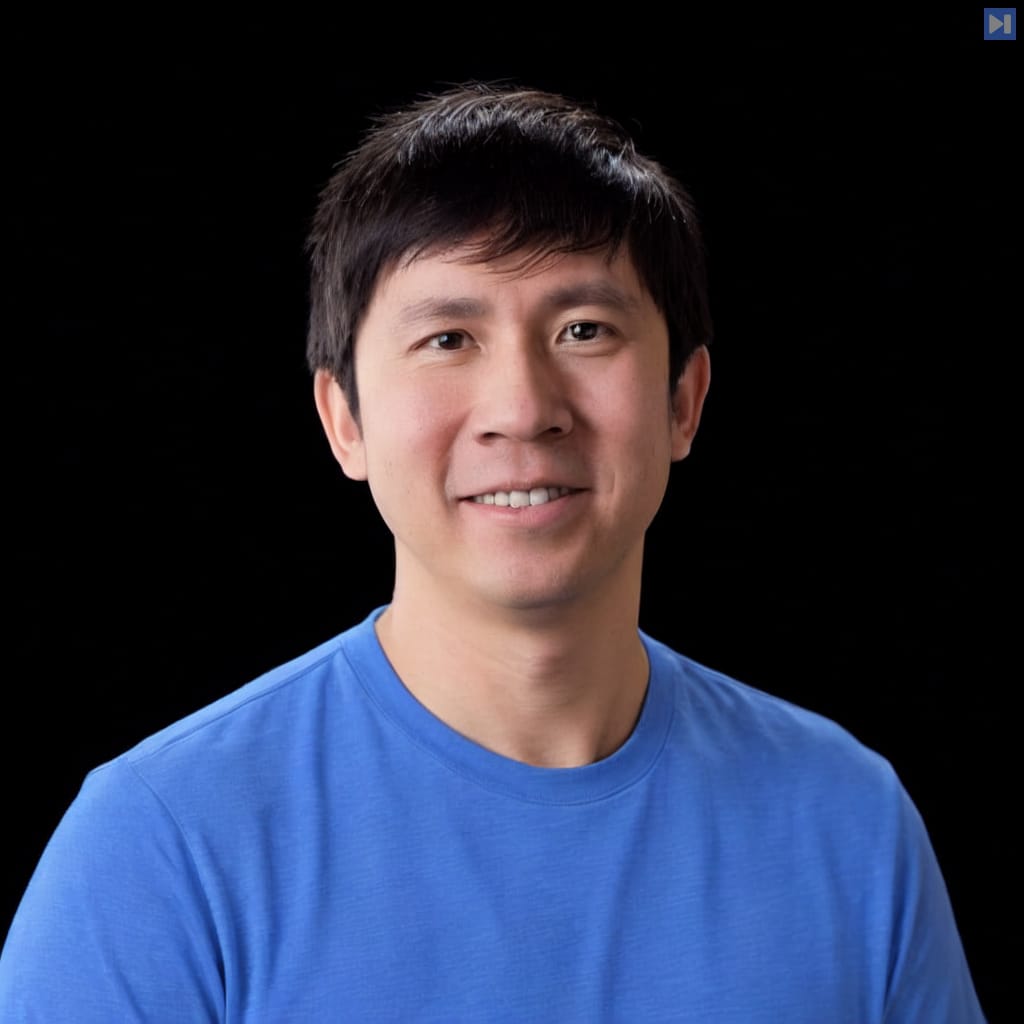 Head-and-shoulders portrait of Andrew Dai against a black background.