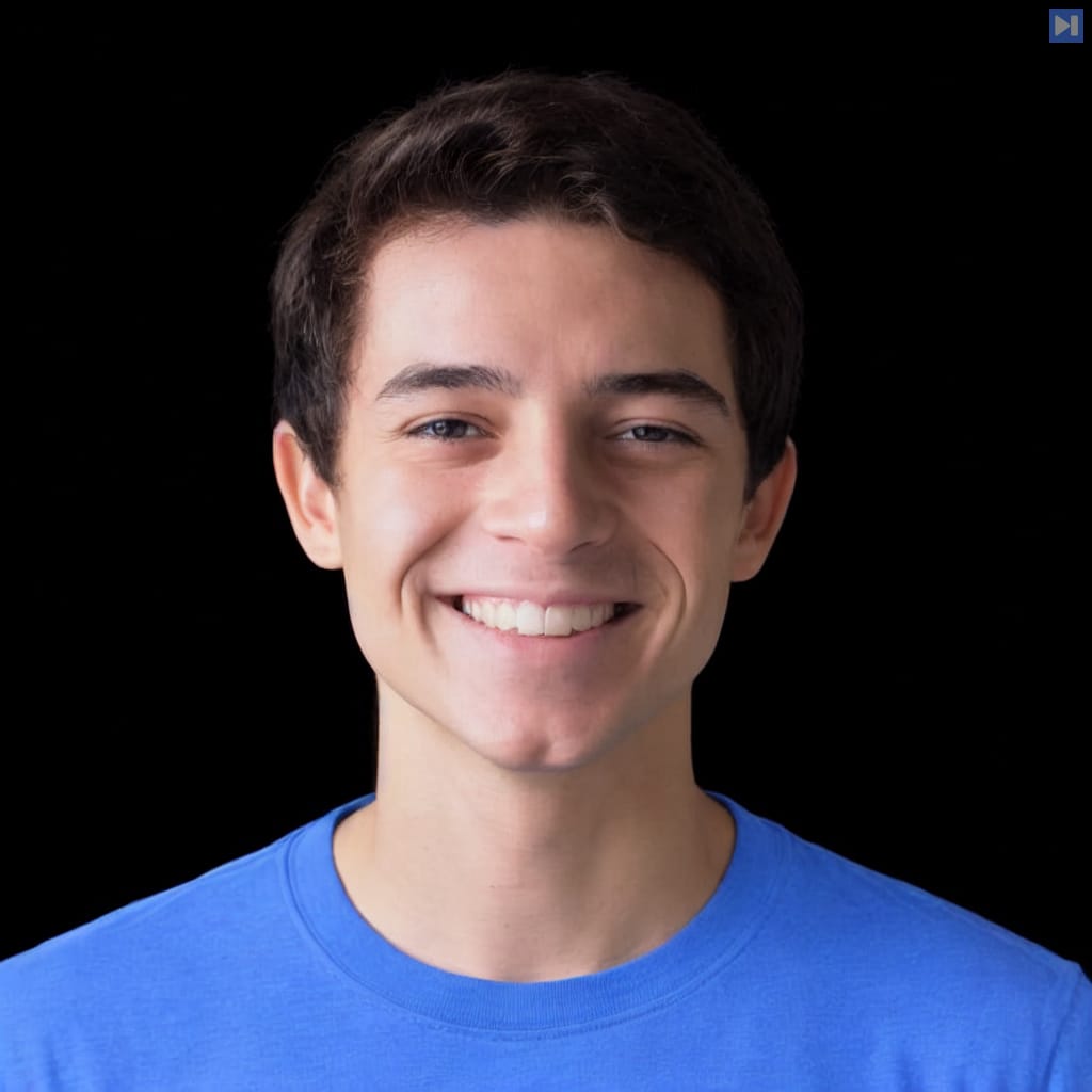 Head-and-shoulders portrait of Andrew Dumit against a black background.