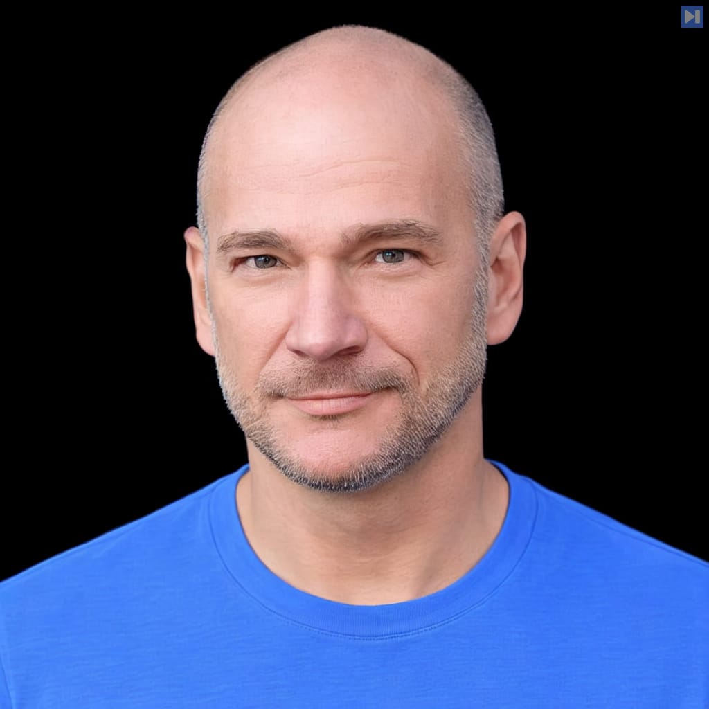 Head-and-shoulders portrait of Andrew McAfee against a black background.