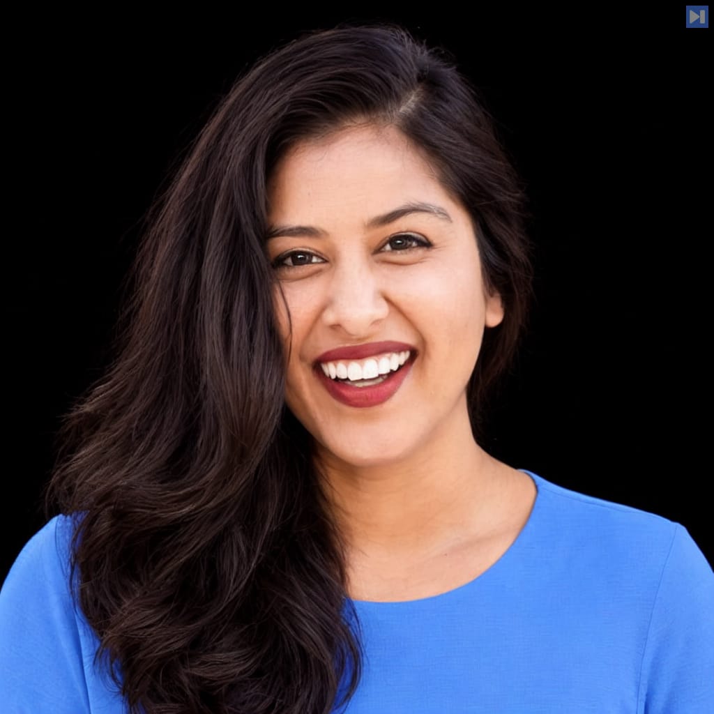 Head-and-shoulders portrait of Aparna Dhinakaran against a black background.