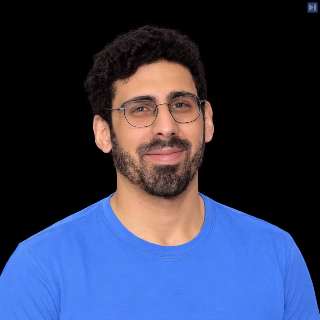 Head-and-shoulders portrait of Asaf Gardin against a black background.
