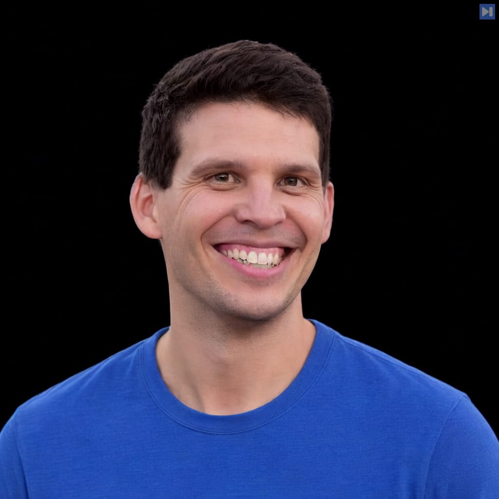 Head-and-shoulders portrait of Ben Dicken against a black background.