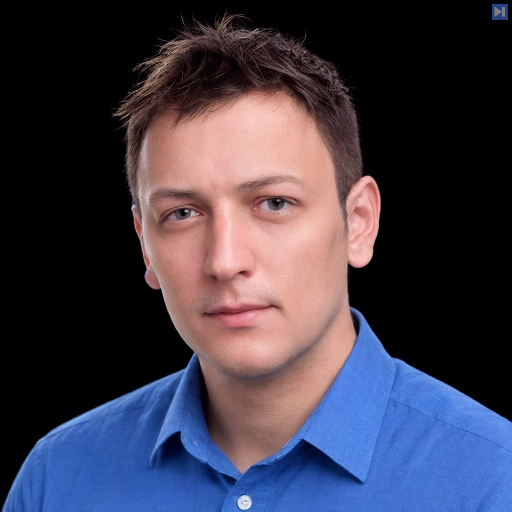 Head-and-shoulders portrait of Ben Thompson against a black background.