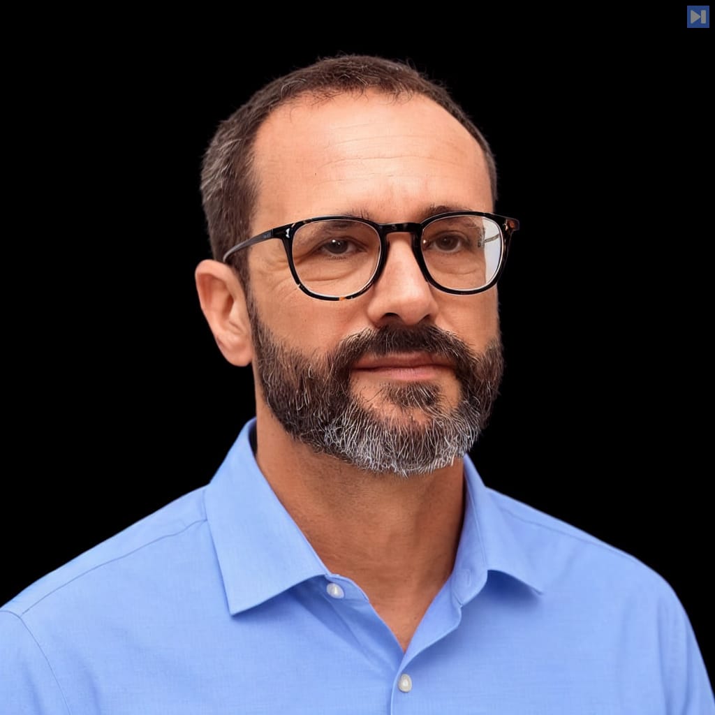 Head-and-shoulders portrait of Boaz Barak against a black background.