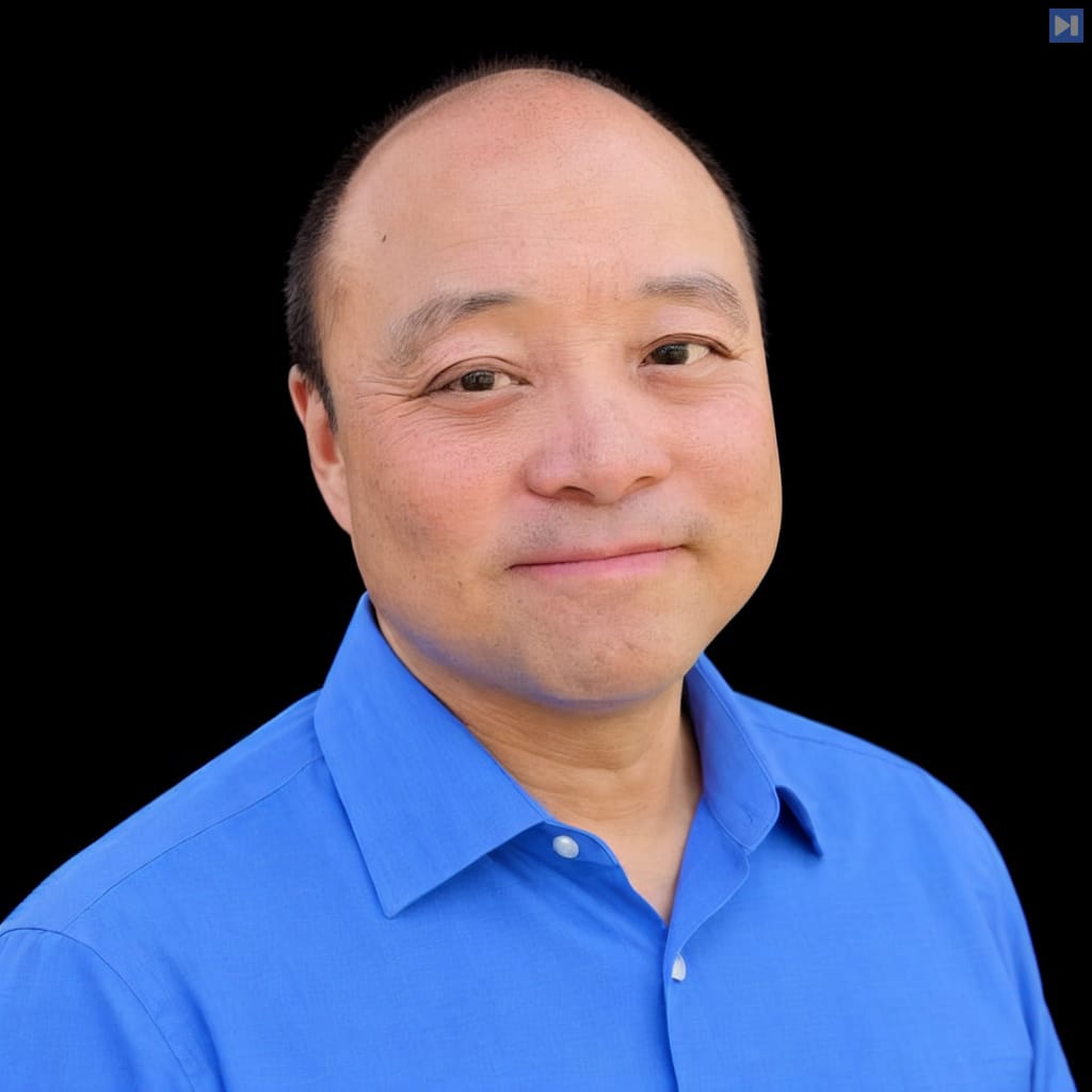 Head-and-shoulders portrait of Brian Wang against a black background.