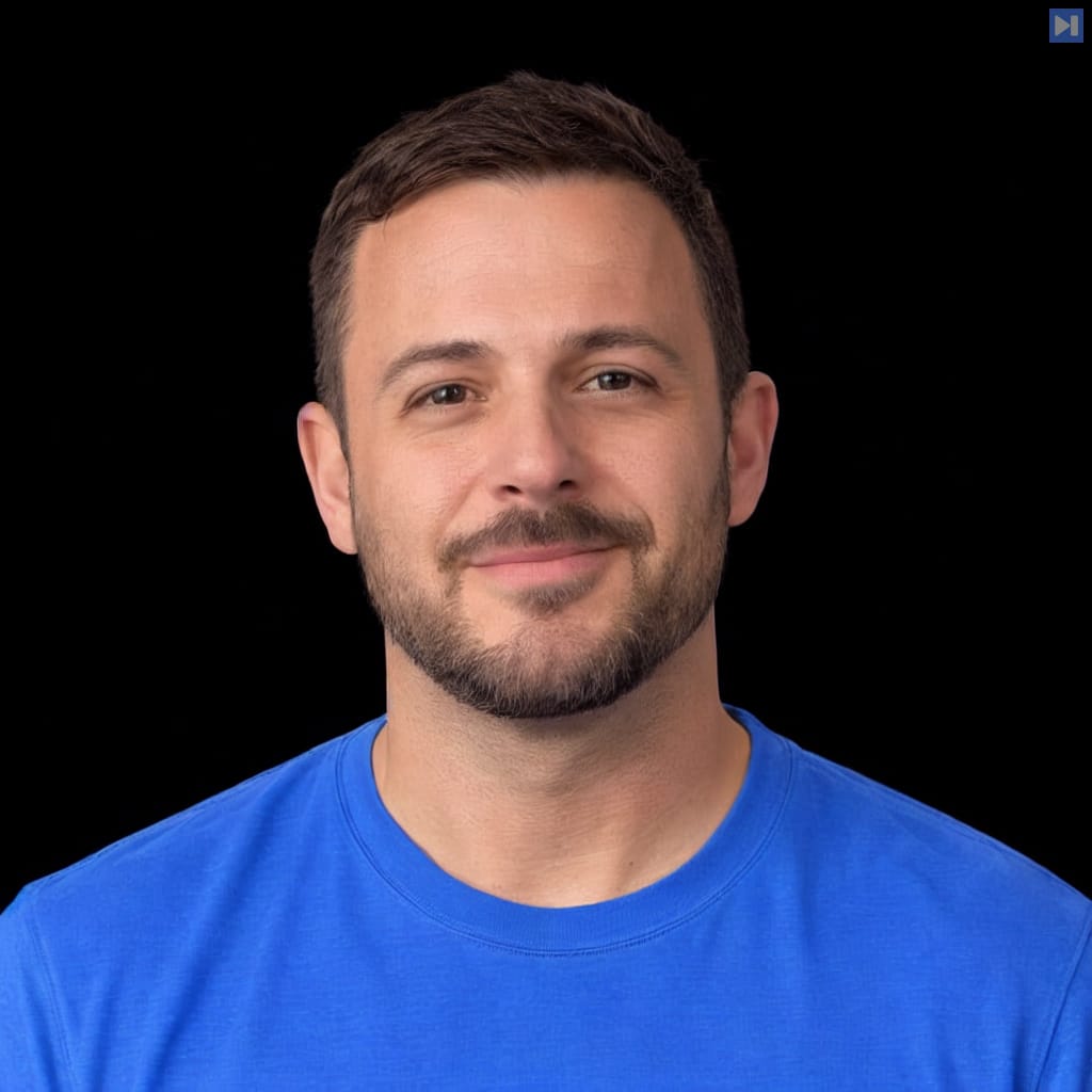 Head-and-shoulders portrait of Dan Arpino against a black background.