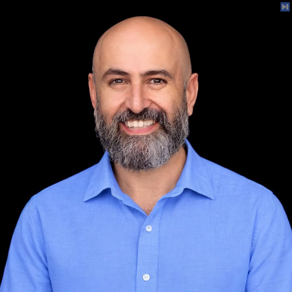 Head-and-shoulders portrait of Daniel Balaceanu against a black background.