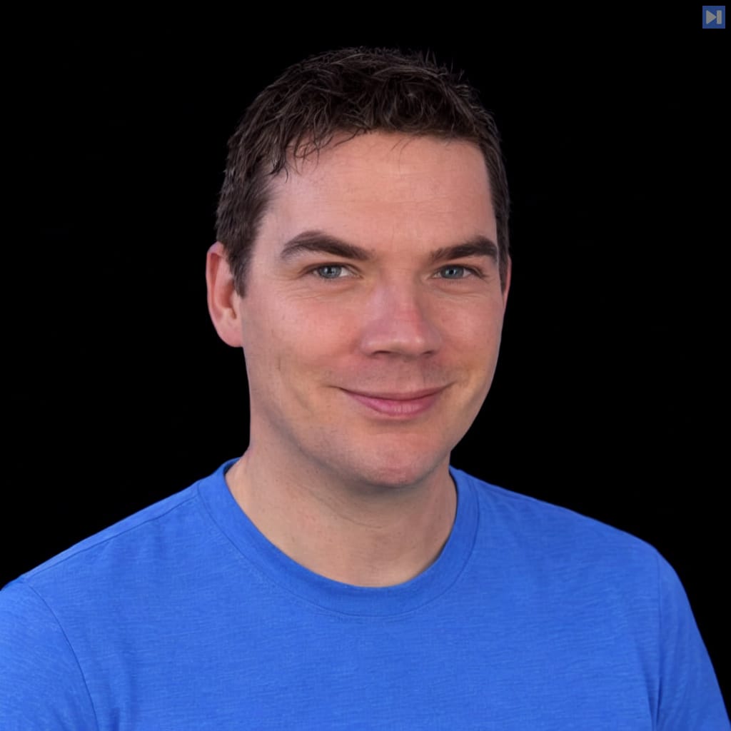 Head-and-shoulders portrait of Daniel Walsh against a black background.