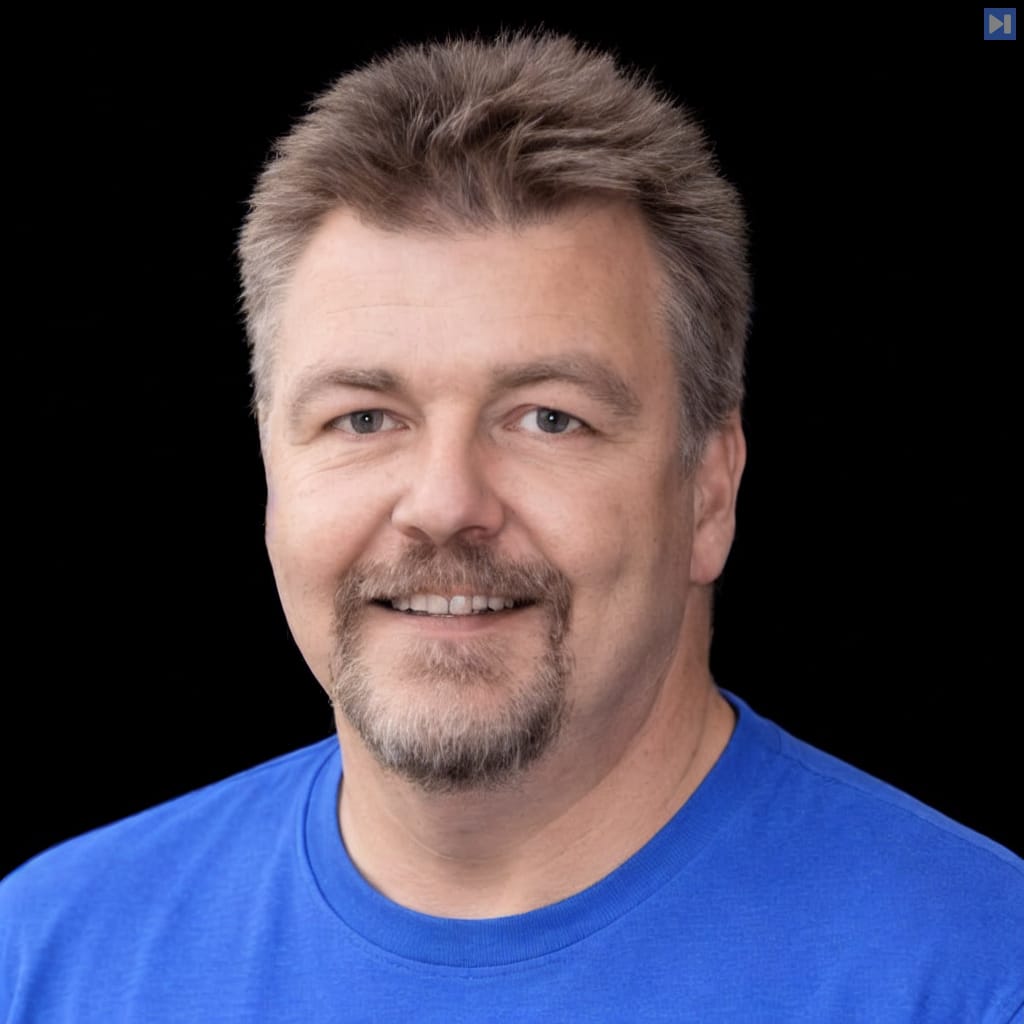 Head-and-shoulders portrait of Dave Plummer against a black background.