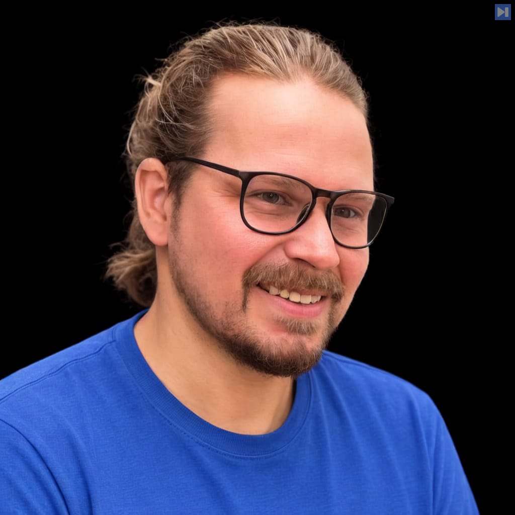Head-and-shoulders portrait of David Carbutt against a black background.