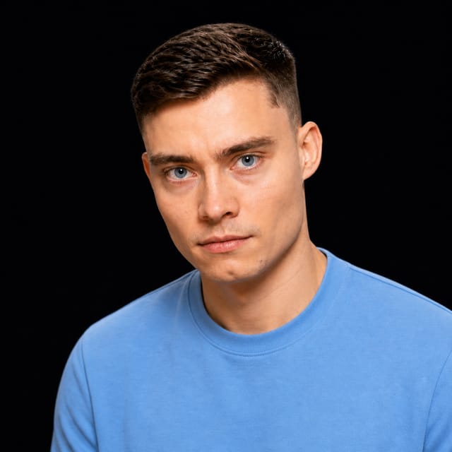 AI-generated portrait of David Ondrej wearing an AI Videos-blue top against a black background.