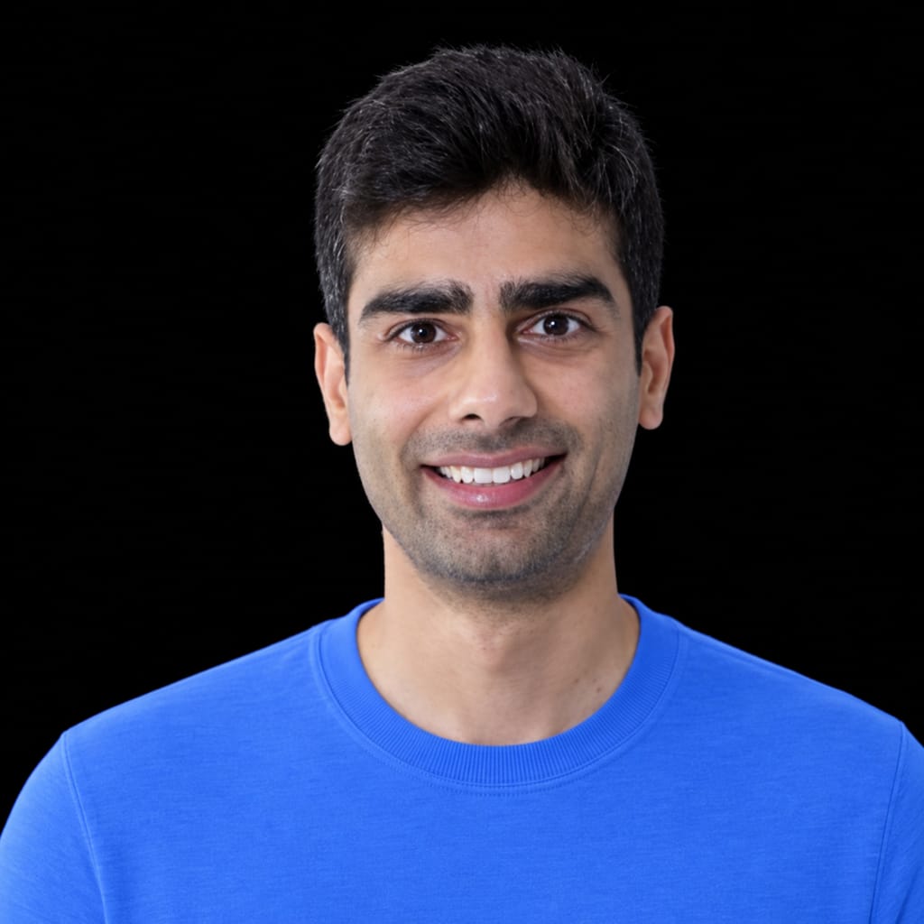 Head-and-shoulders portrait of Devansh Tandon against a black background.