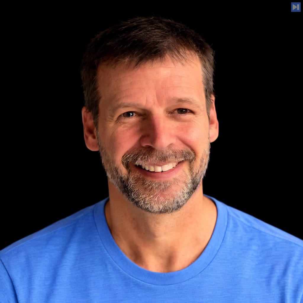 Head-and-shoulders portrait of Dick Hardt against a black background.