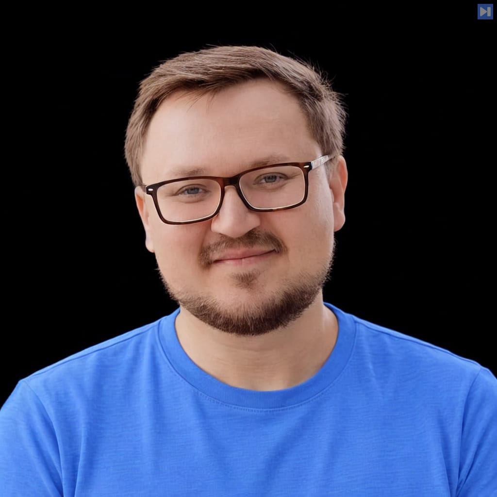 Head-and-shoulders portrait of Dmitry Petrov against a black background.