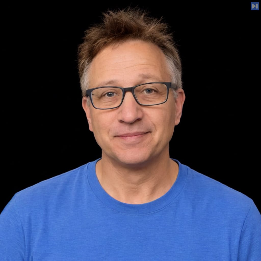 Head-and-shoulders portrait of Dotta against a black background.