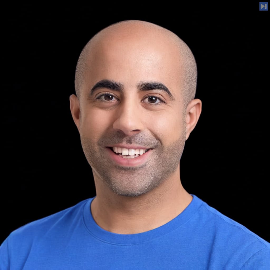 Head-and-shoulders portrait of Eli Cohen against a black background.
