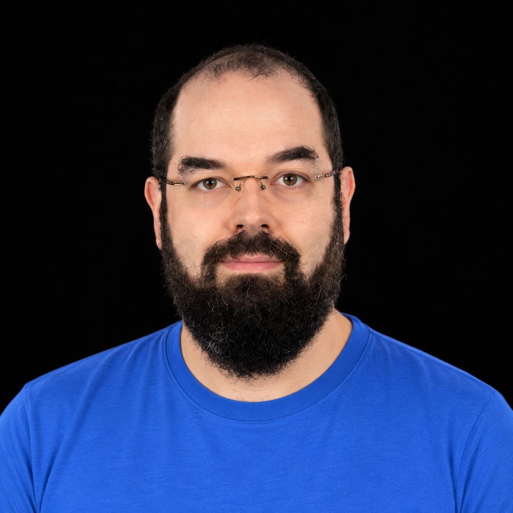 Head-and-shoulders portrait of Eliezer Yudkowsky against a black background.