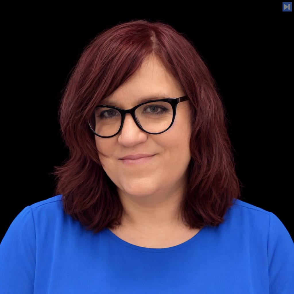 Head-and-shoulders portrait of Em Shreve against a black background.