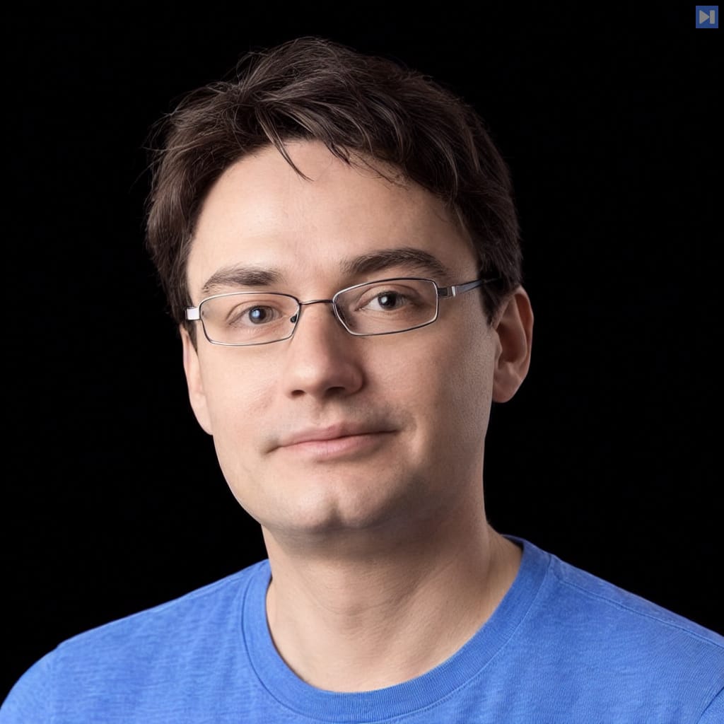 Head-and-shoulders portrait of François Chollet in a light blue top against a black background.