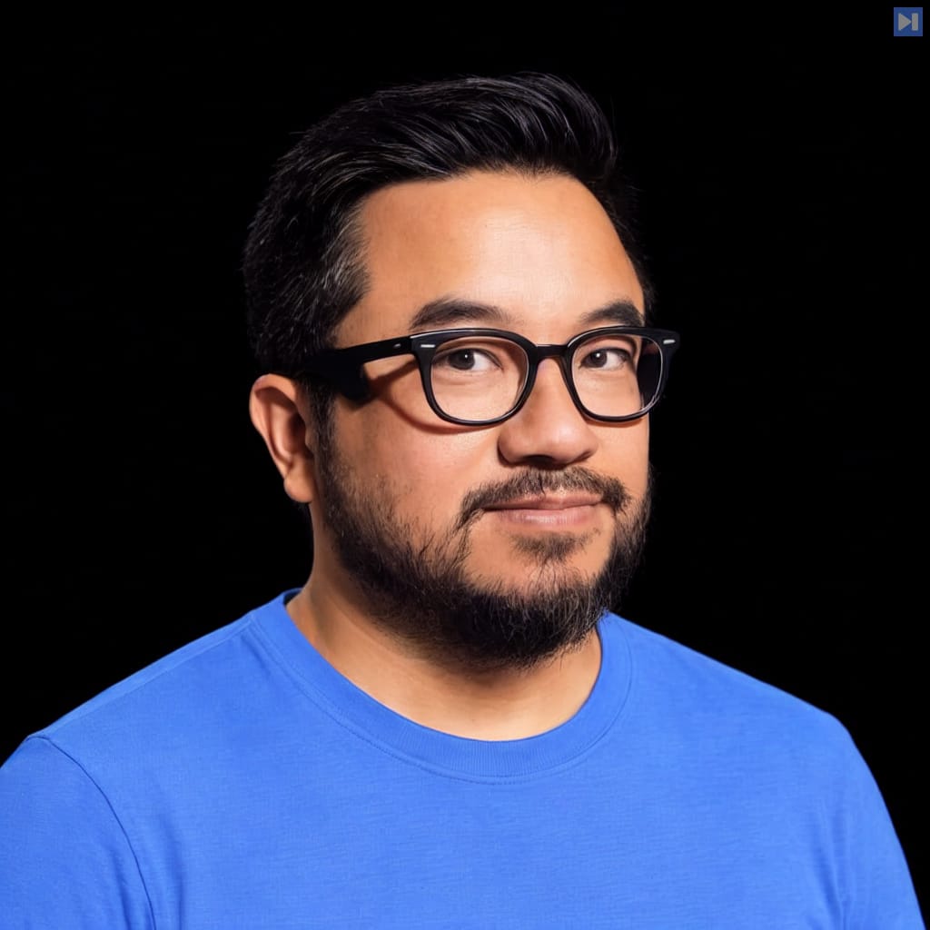 Head-and-shoulders portrait of Garry Tan against a black background.