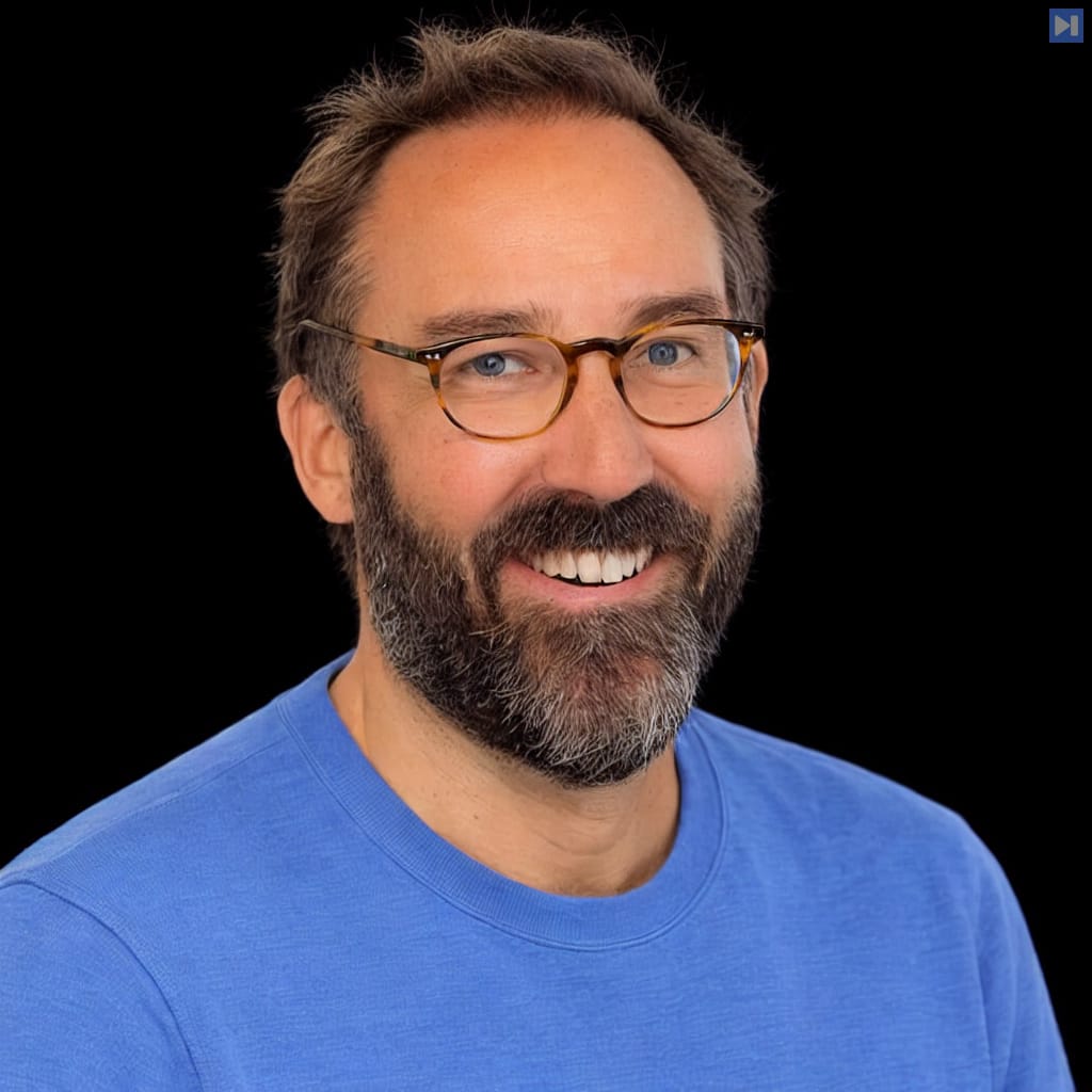 Head-and-shoulders portrait of Gavin Baker against a black background.