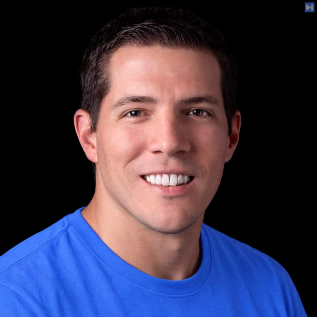 Head-and-shoulders portrait of Gergely Orosz against a black background.