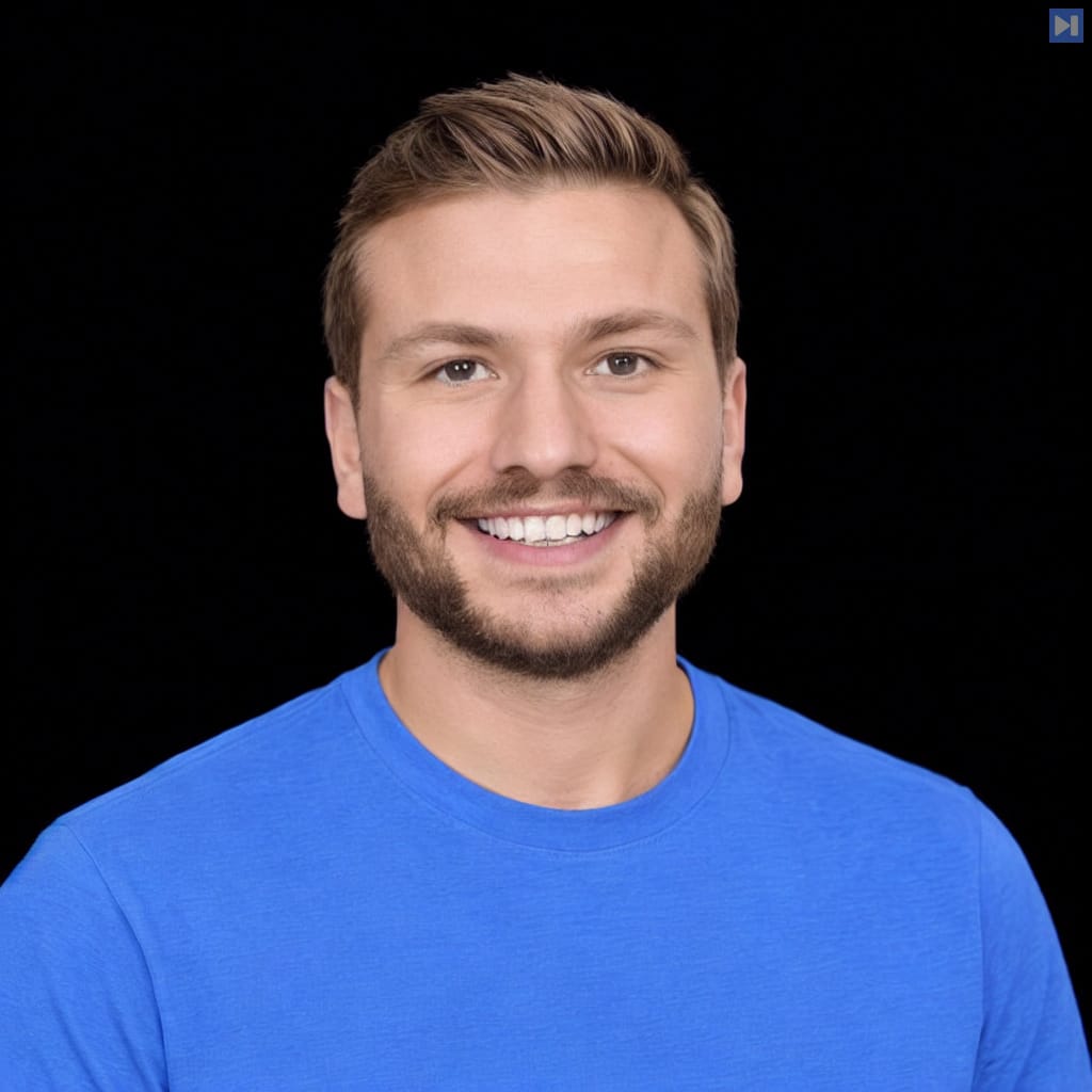 Head-and-shoulders portrait of Gil Feig against a black background.