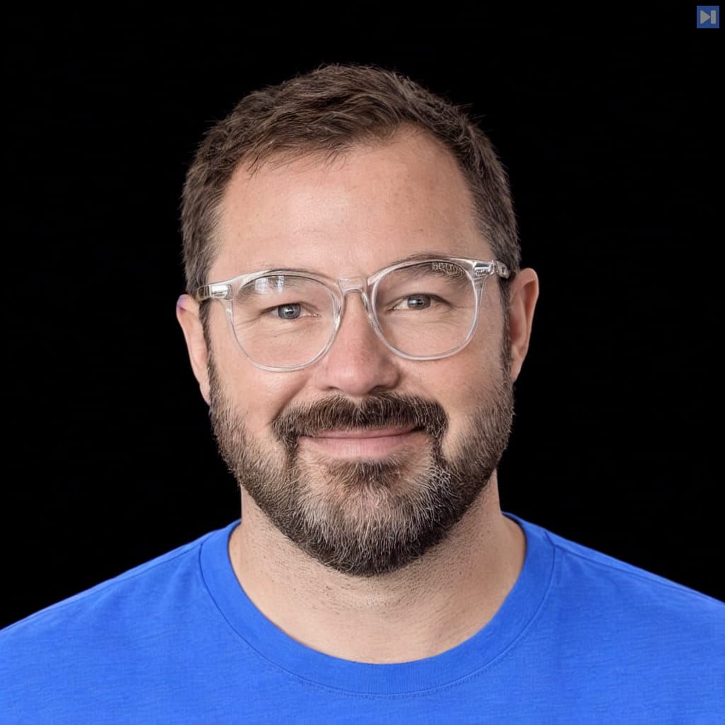 Head-and-shoulders portrait of Graham McBain against a black background.