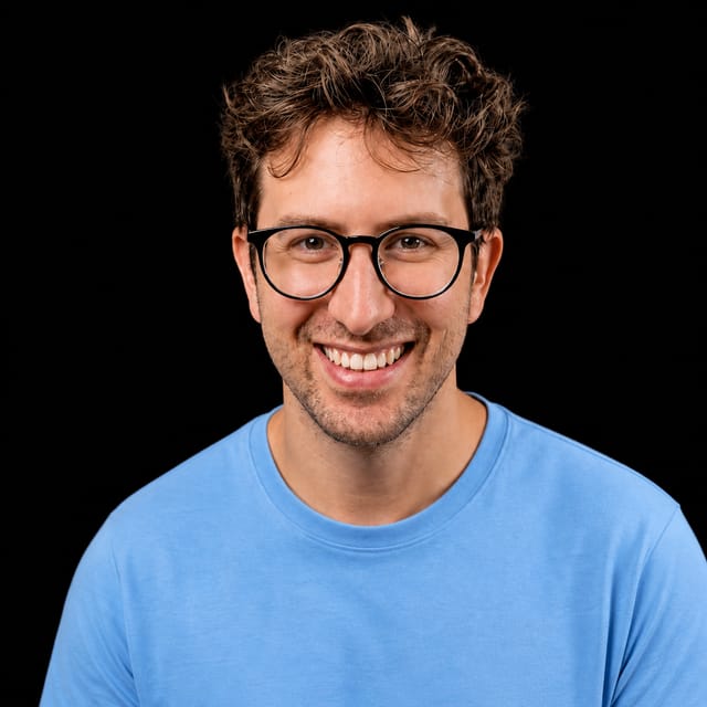 AI-generated portrait of Greg Isenberg wearing an AI Videos-blue top against a black background.