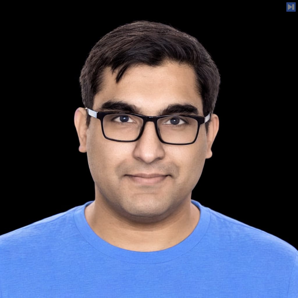 Head-and-shoulders portrait of Hamza Tahir against a black background.
