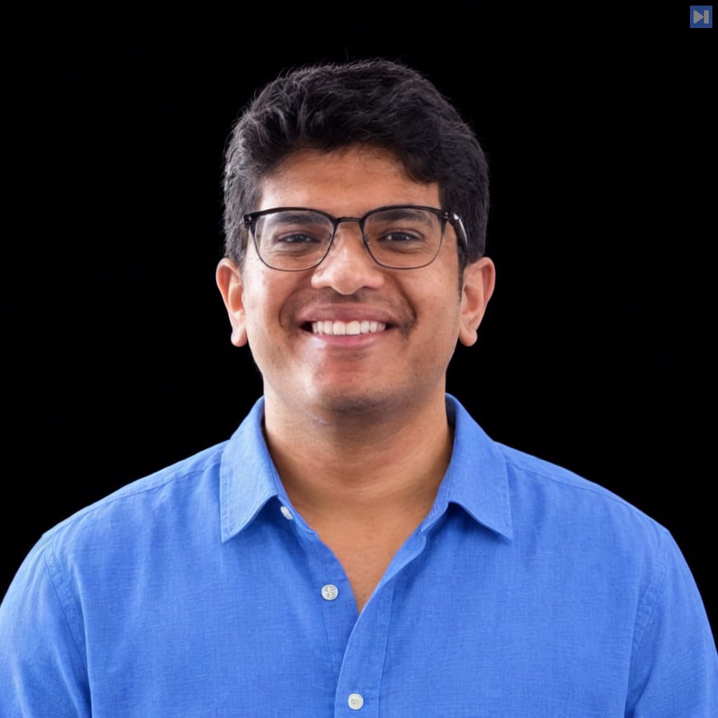 Head-and-shoulders portrait of Hrishi Olickel against a black background.