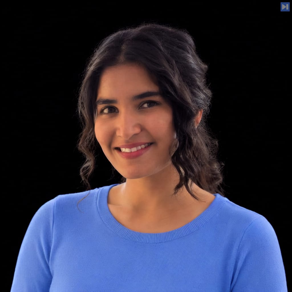 Head-and-shoulders portrait of Ishita Daga against a black background.