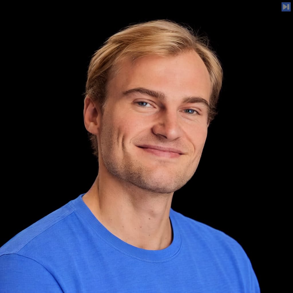 Head-and-shoulders portrait of Jacob Lauritzen against a black background.