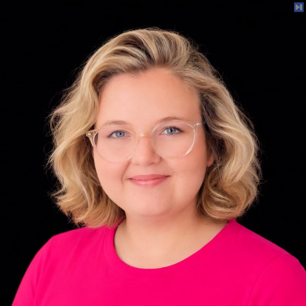 Head-and-shoulders portrait of Jacqueline Henriksen against a black background.