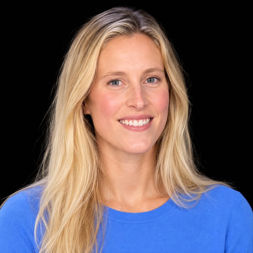 Head-and-shoulders portrait of Jacqueline Wood against a black background.