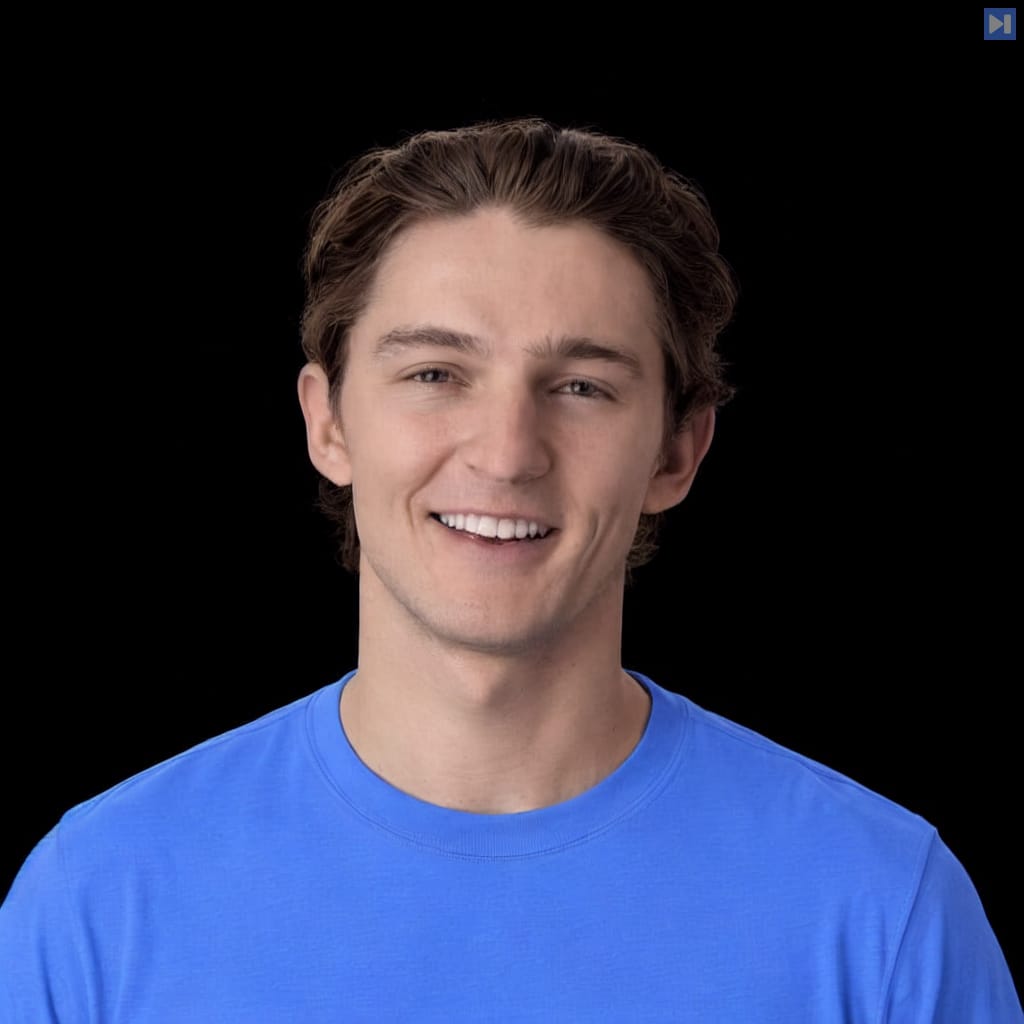 Head-and-shoulders portrait of Jake Broekhuizen against a black background.