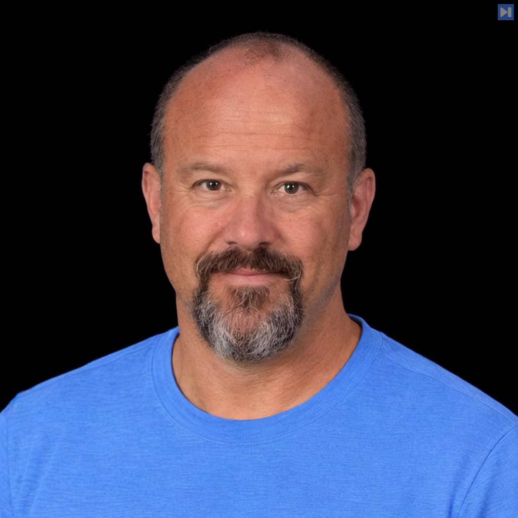Head-and-shoulders portrait of James Williams against a black background.