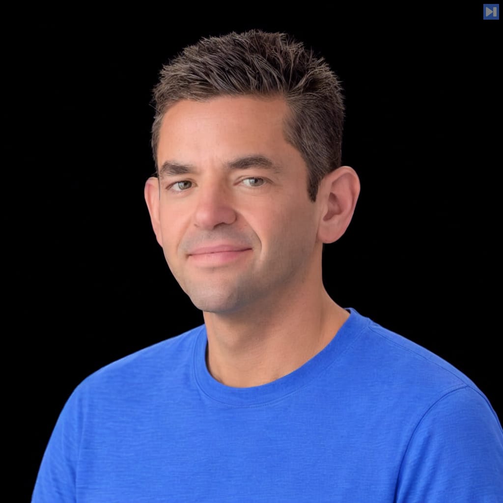 Head-and-shoulders portrait of Jared Isaacman against a black background.