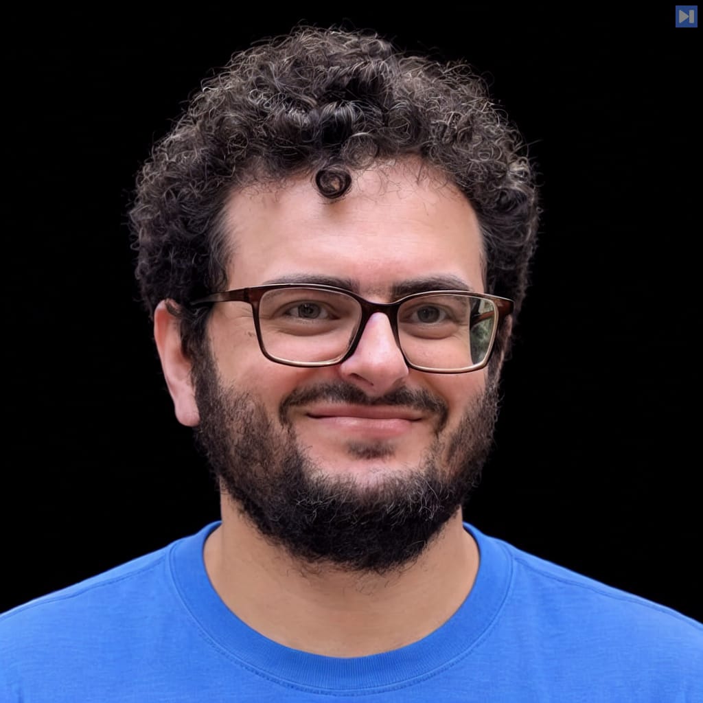 Head-and-shoulders portrait of Jason Gross against a black background.