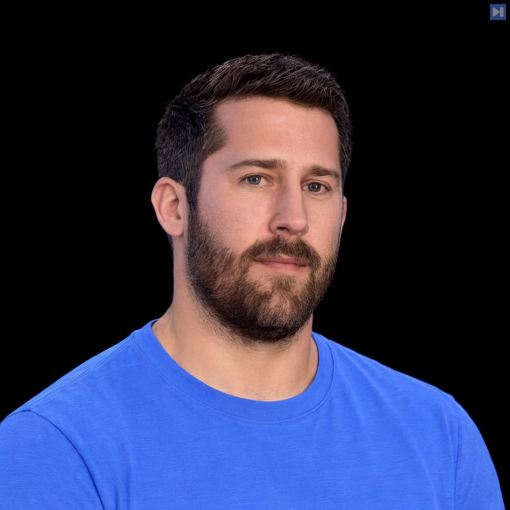 Head-and-shoulders portrait of Jason Kramberger against a black background.