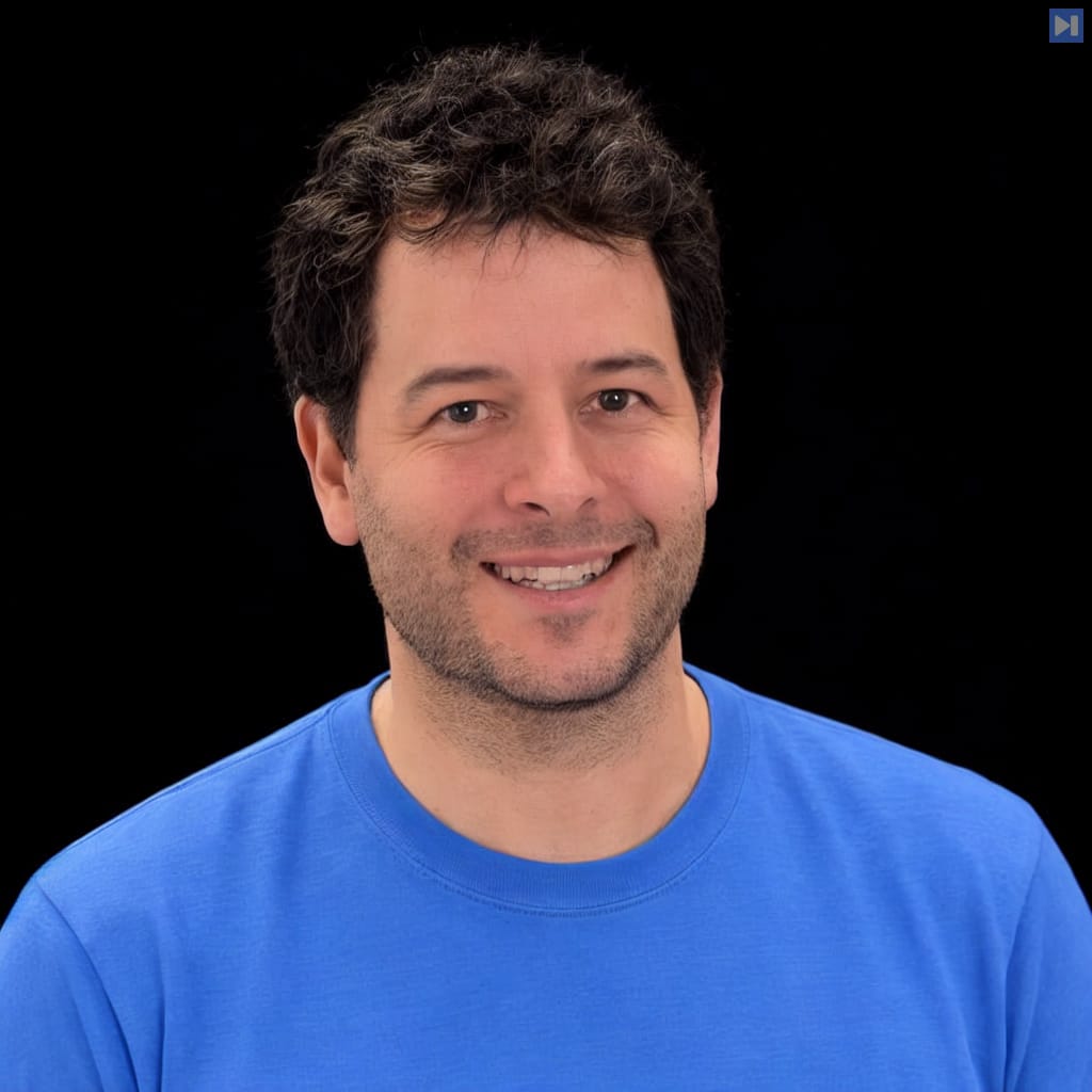 Head-and-shoulders portrait of Javi Lopez against a black background.